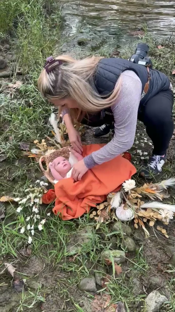 Lauren preparing an infant portrait outdoors