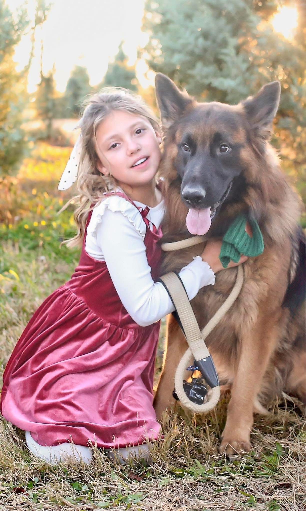 Young girl outdoors with a pony