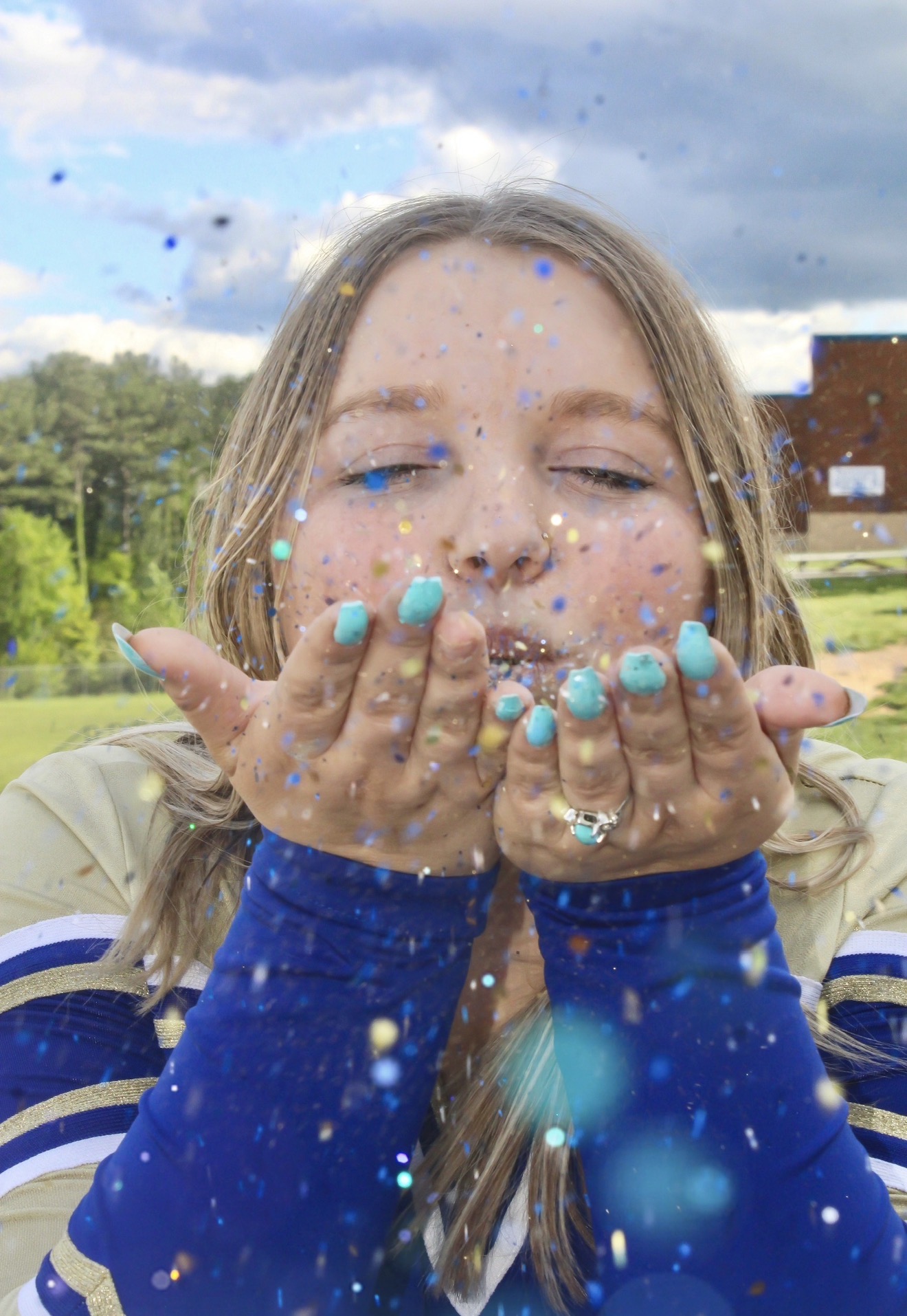 Playful senior portrait with confetti